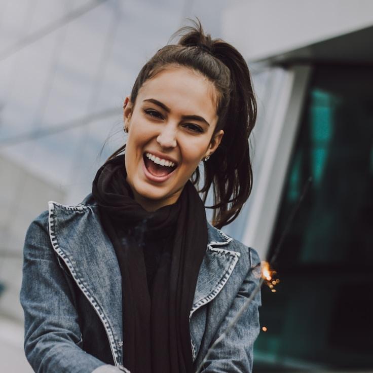 Kaveri Mehta, Lead Design Curator at Global Wellness Path, reviewing corporate floral arrangements